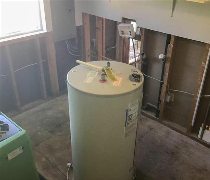 Hot water heater in a demolition basement
